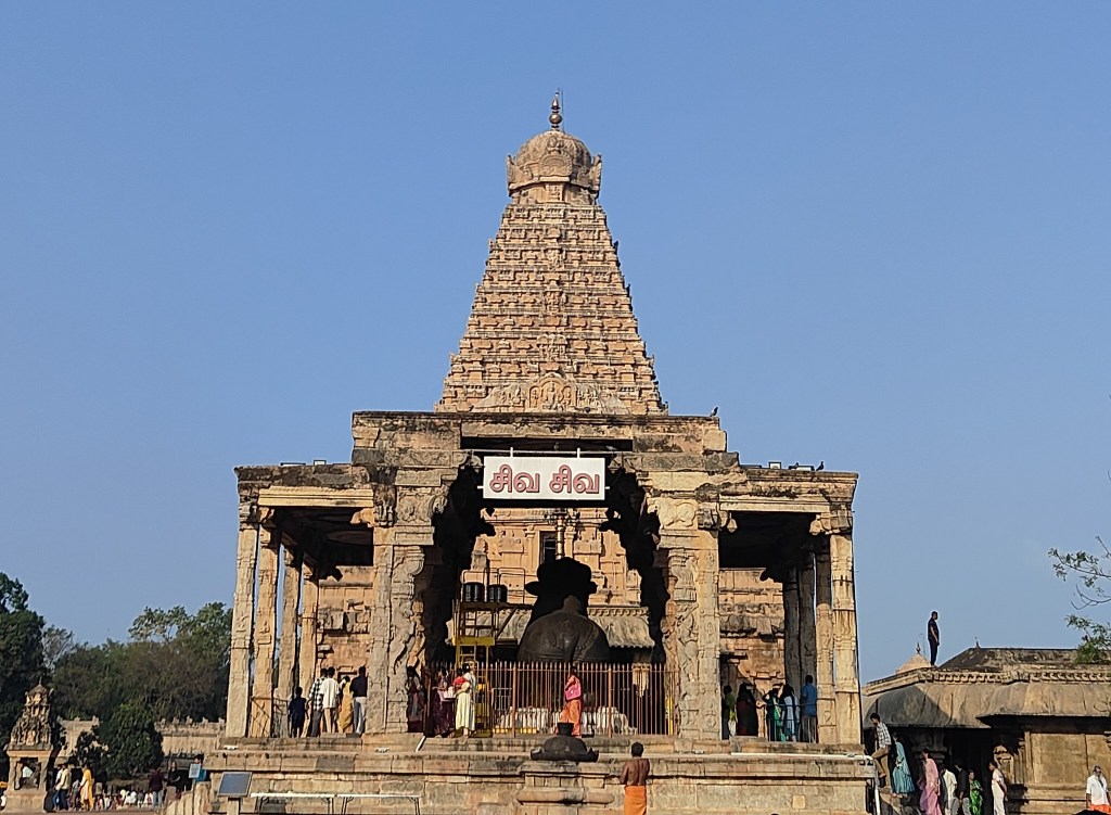 The massive vimana gopuram of Brihadeeswara Temple, Thanjavur, looming over the Nandi Mandapam — a 216-foot Chola granite tower built in 1010 CE