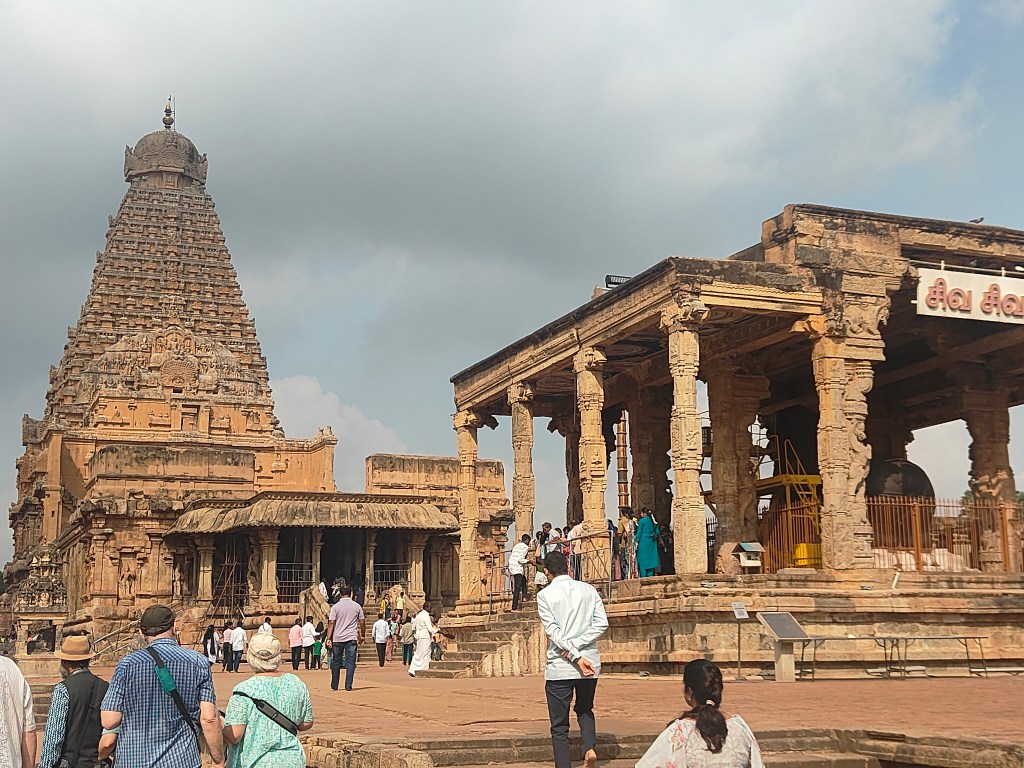 Pilgrims and travellers at the Nandi Mandapam, Brihadeeswara Temple, Thanjavur — a UNESCO World Heritage Site and living Chola temple